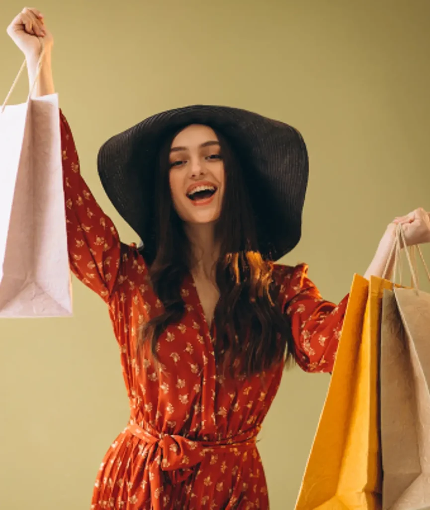 young-woman-with-shopping-bags-beautiful-dress-hat